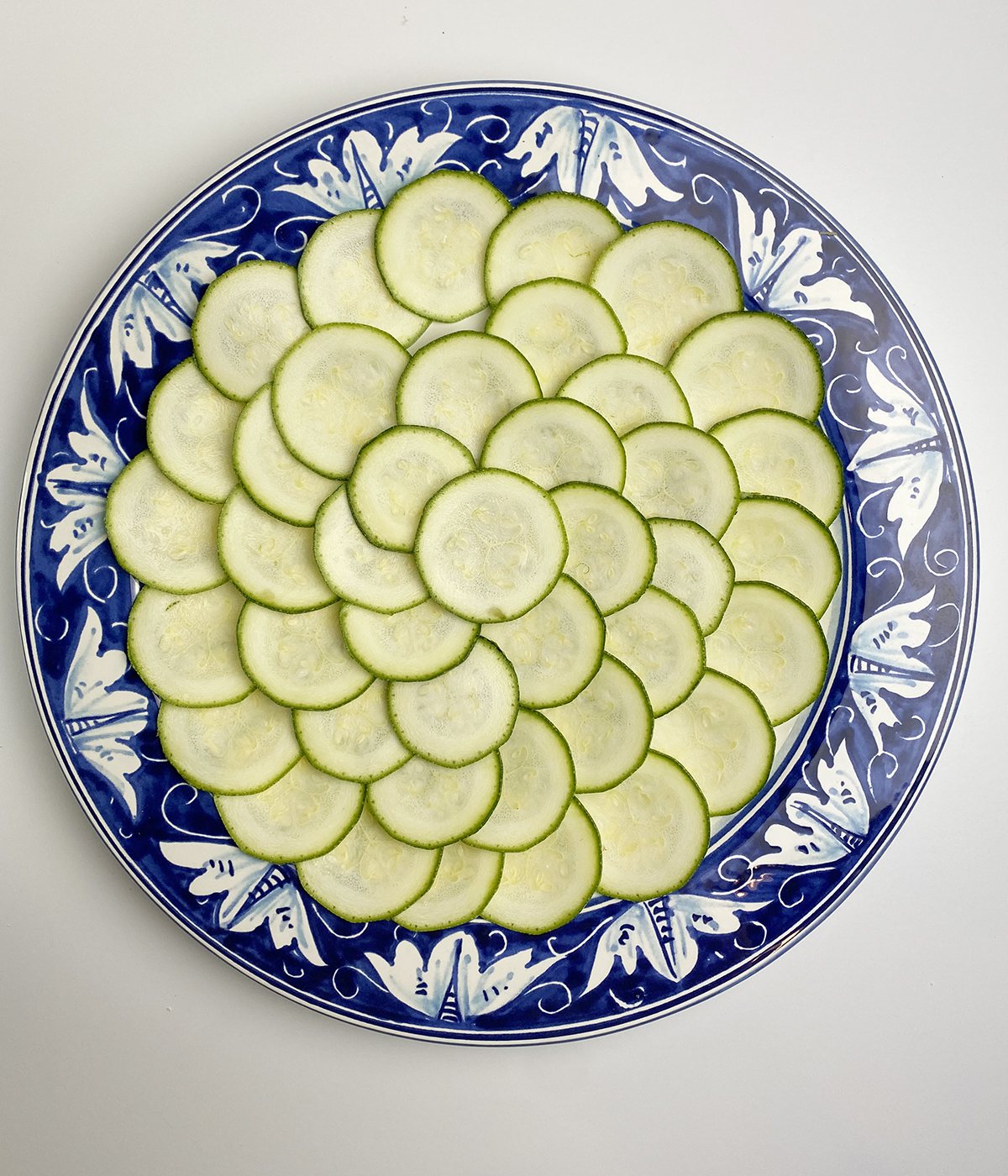 Zucchini slices layered on a plate.