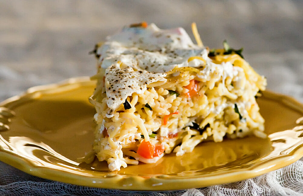 Slice of spaghetti cake on a plate.