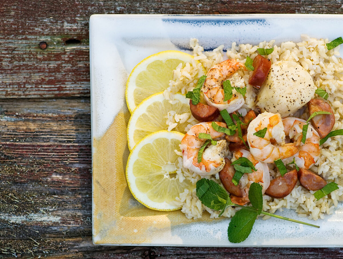 Grilled seafood with lemon on a platter.