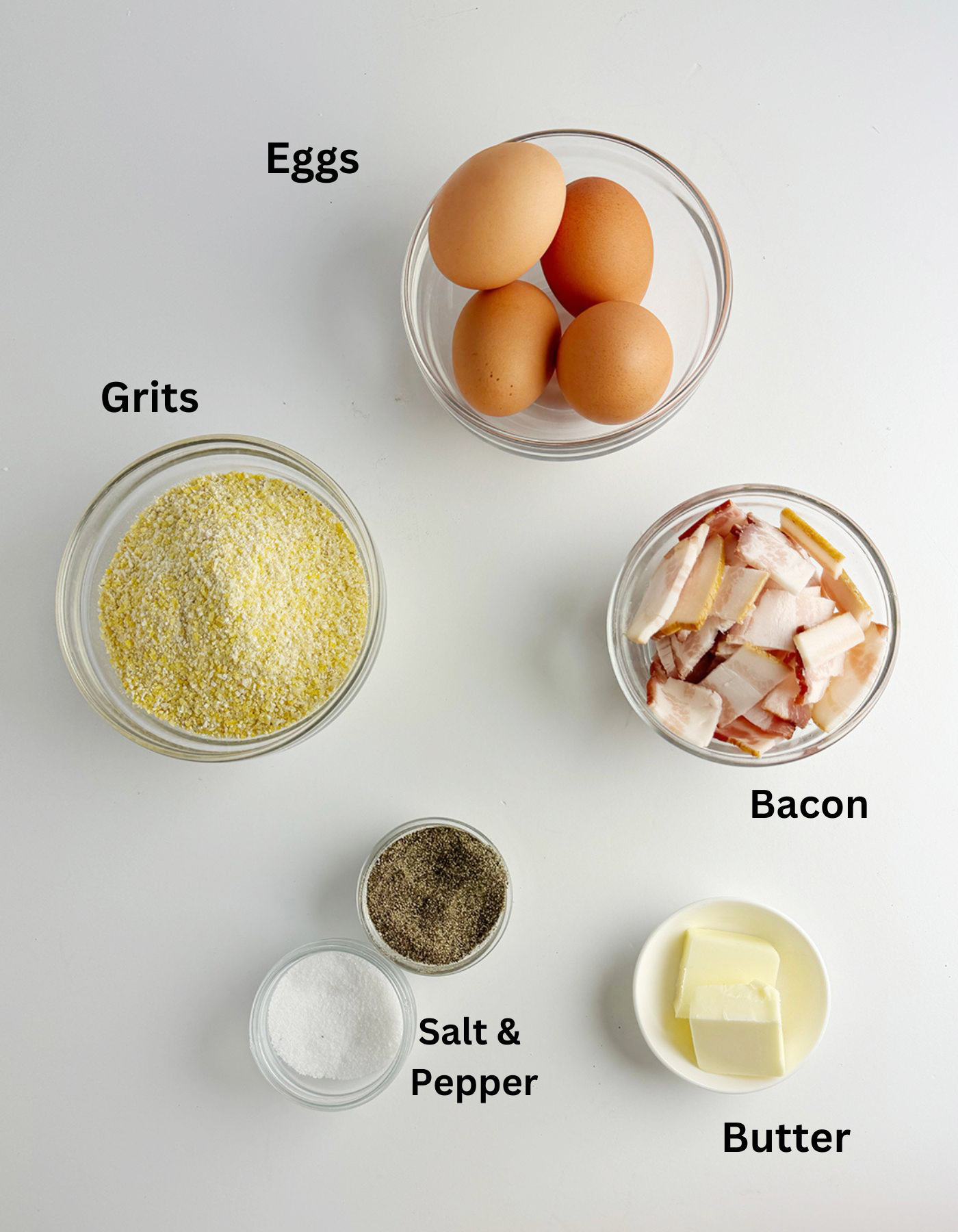 Ingredients for eggs with creamy bacon grits.