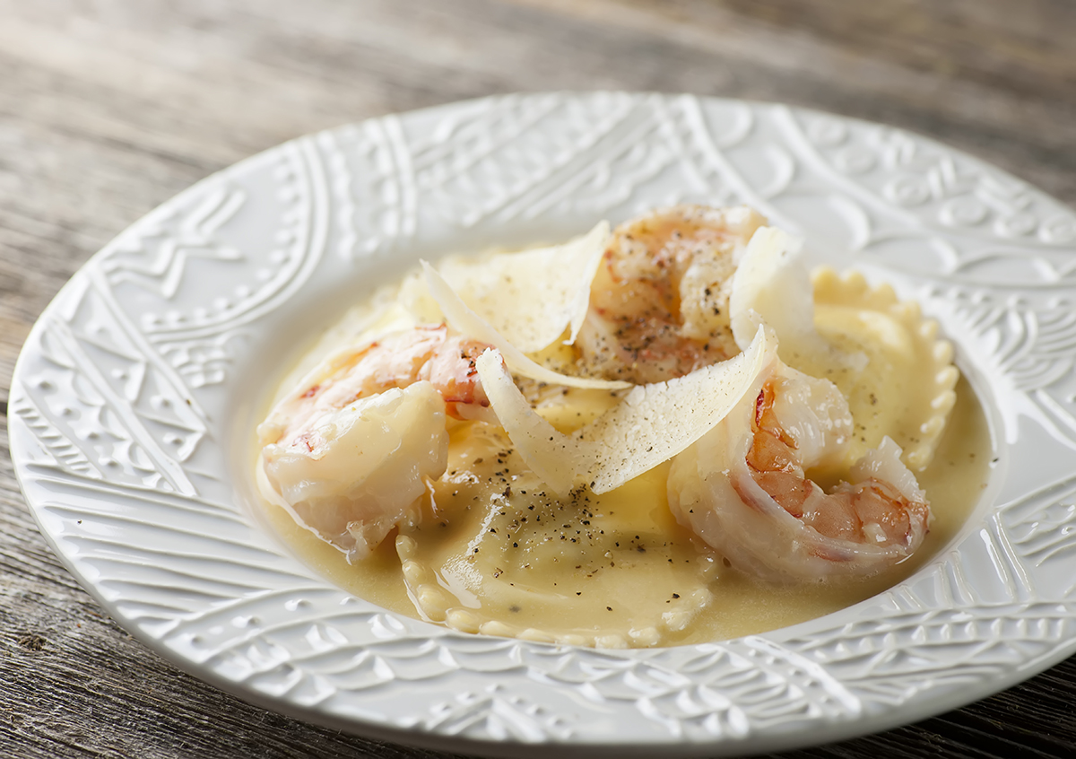 Shrimp scampi ravioli on a plate.