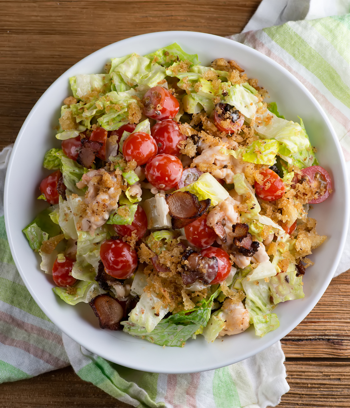 Lobster BLT salad in a bowl.