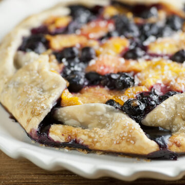 Easy blueberry peach tart on a plate.