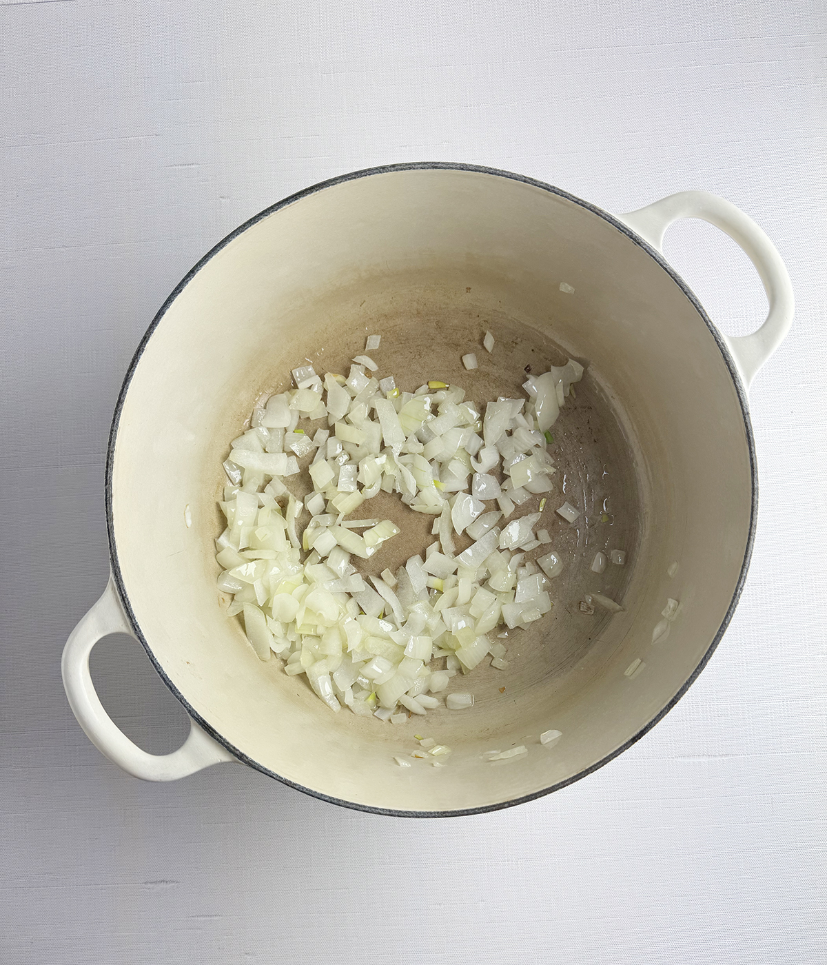 Cooked onions in a pot.