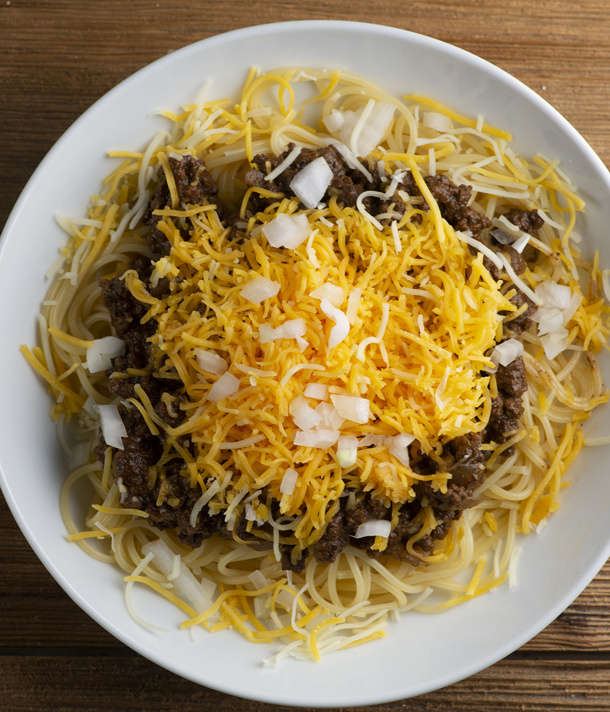 Four way cincinnati chili in a bowl.