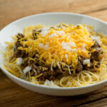 Cincinnati Chili in a bowl with toppings.