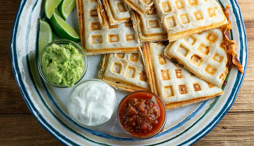 https://www.framedcooks.com/wp-content/uploads/2020/05/easy-waffle-iron-bacon-and-cheese-quesadillas.jpg.webp