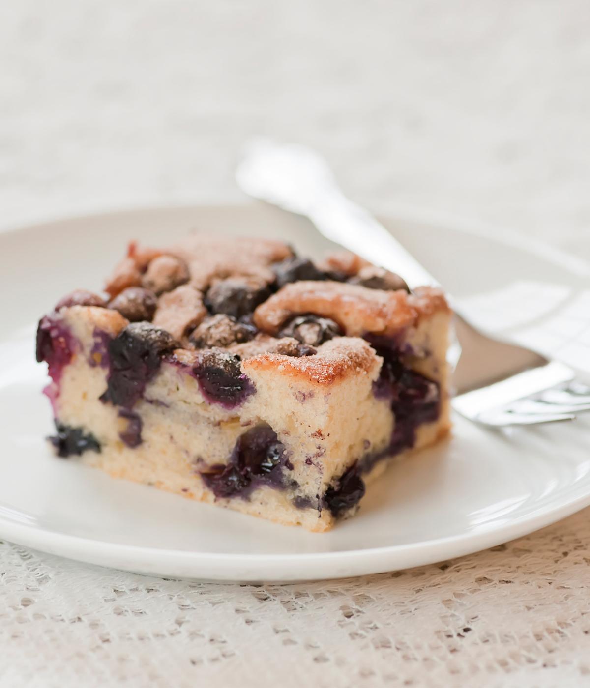 Blueberry boy bait on a plate with a fork.