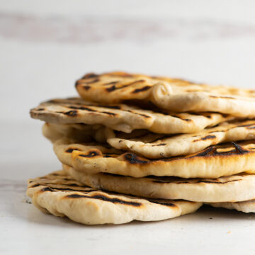 Stack of grilled flatbread.