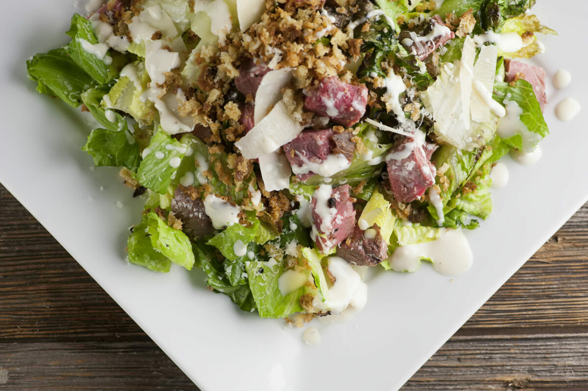 Steak Caesar Salad on a plate.