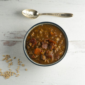 Beef barley soup in a bowl.